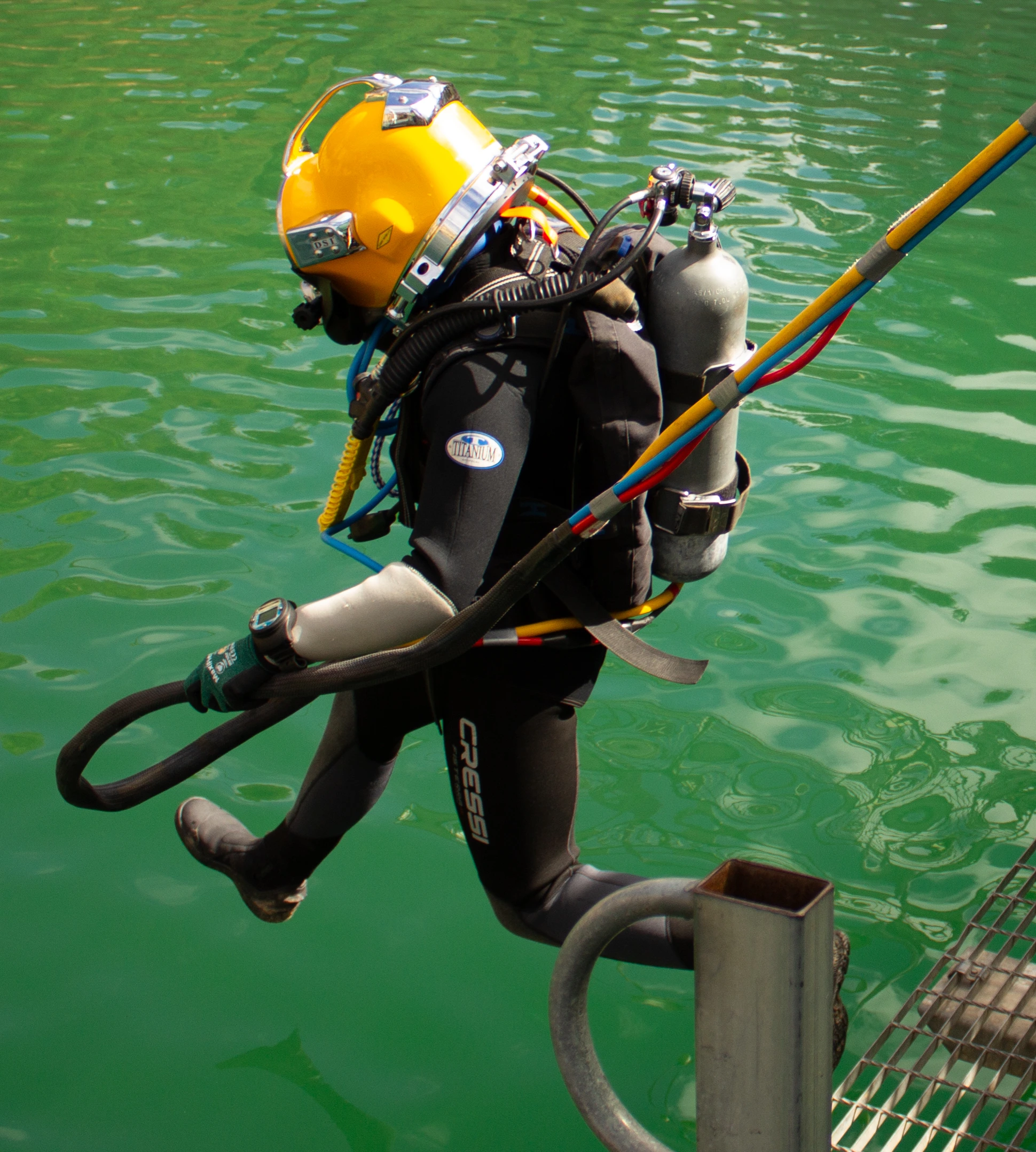 Commercial diver entering the water in full SCUBA kit, Occupational SCUBA to 30m training at UTCSA Burra