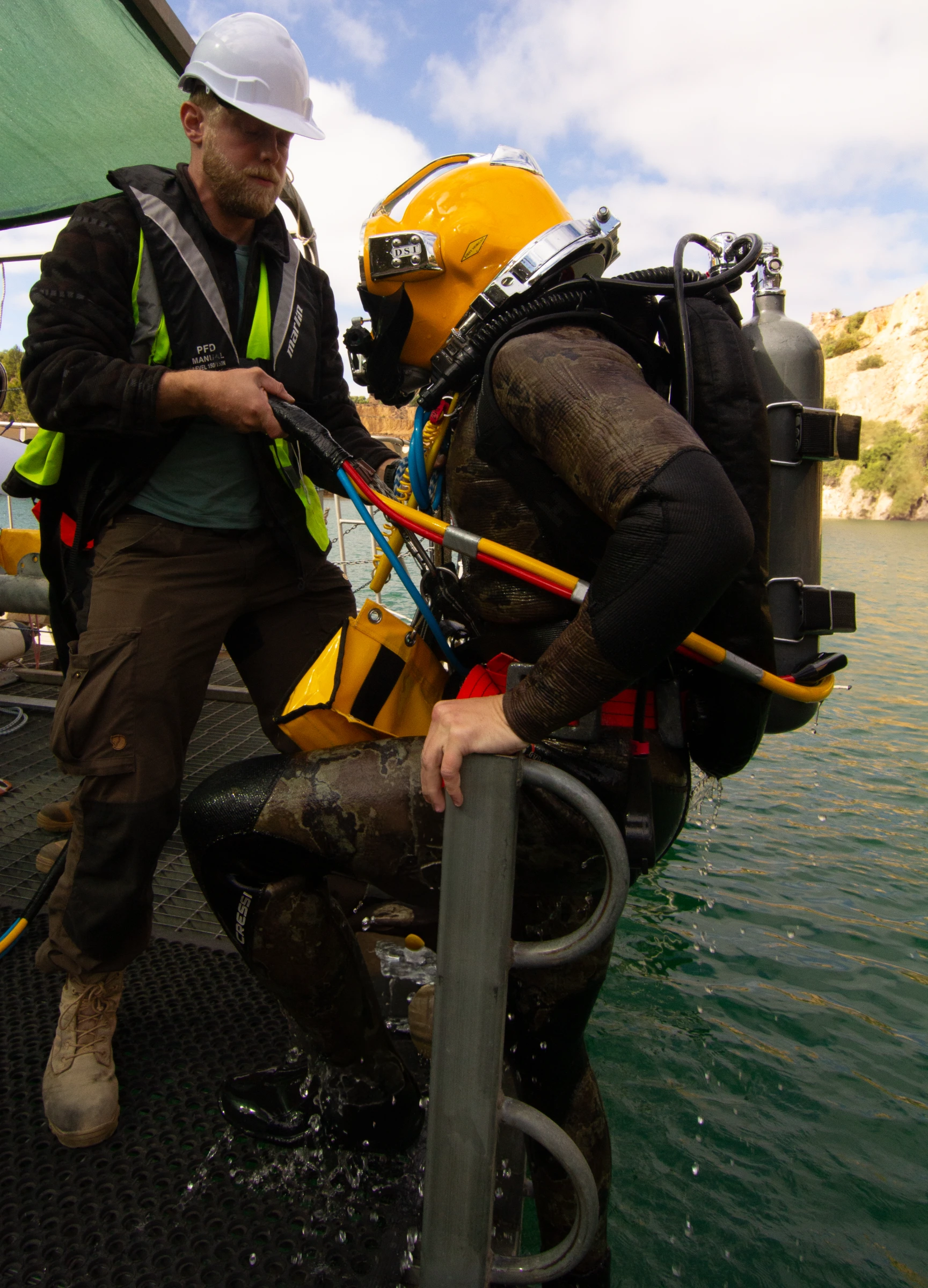 UTCSA tender assisting student diver onto the dive platform