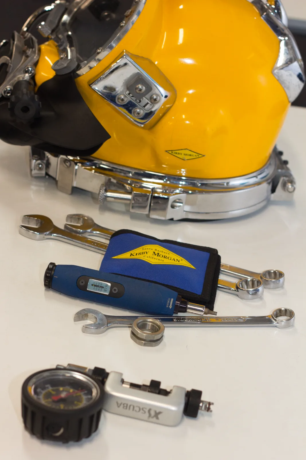 Kirby Morgan KM37 helmet stripped down for servicing with manufacturer torque tool and spanners, Kirby Morgan Maintenance Technician training at UTCSA Burra